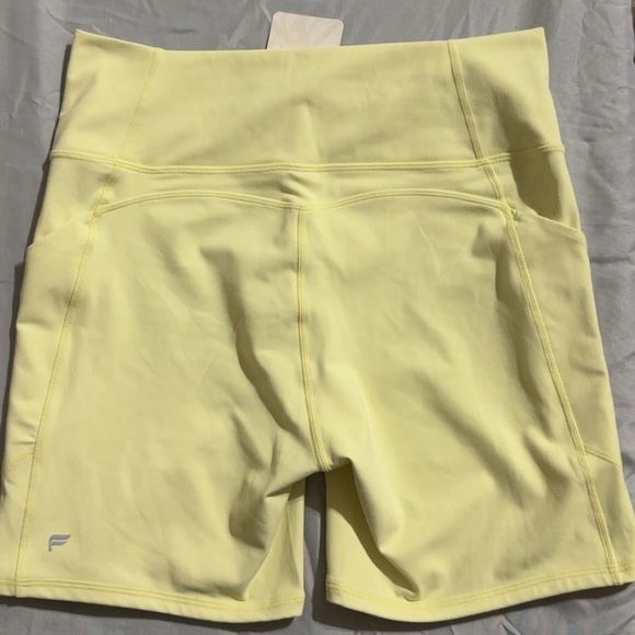 Fabletics Pure Luxe High Waisted Pastel Yellow Bike Shorts 6” - Picture 2 of 6
